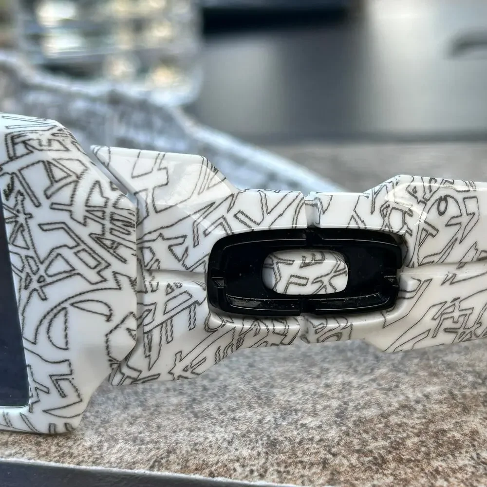 Oakley Oil Rig sunglasses  White frame covered in black graphic text Gray lens